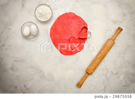Red dough with a cut out heart, rolling pin Red dough with a cut out heart, rolling pin 29875038