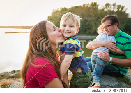 Family with two boys at the lake, sunny spring day Family with two boys at the lake, sunny spring day 29877811