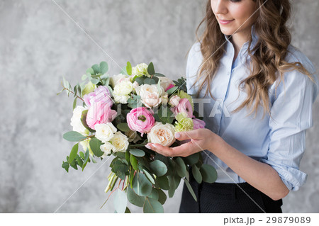 Florist at work: pretty young woman making fashion 29879089
