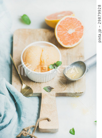 Pink grapefruit sorbet with fresh mint leaves in 29879928