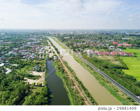 Irrigation Canal with village in countryside 29881409