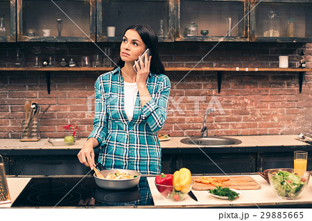 Young woman cooking on kitchen Young woman cooking on kitchen 29885665