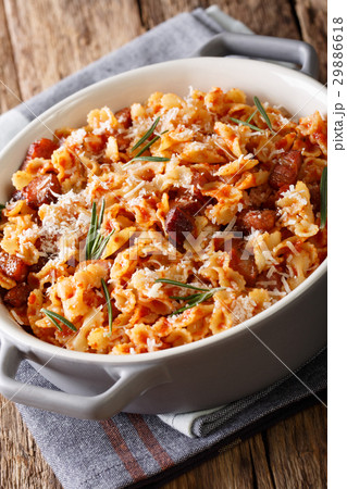 Pasta farfaline with tomato, bacon and cheese 29886618