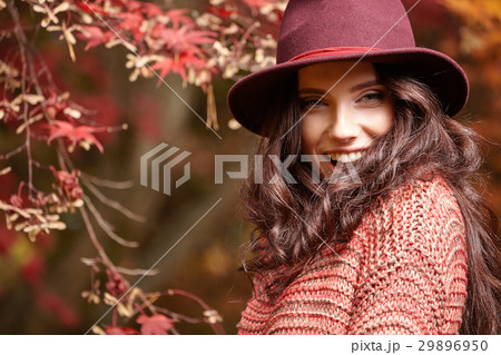 Fashionable woman and fall yellow, red maple park background. Fashionable woman and fall yellow, red maple park background. 29896950