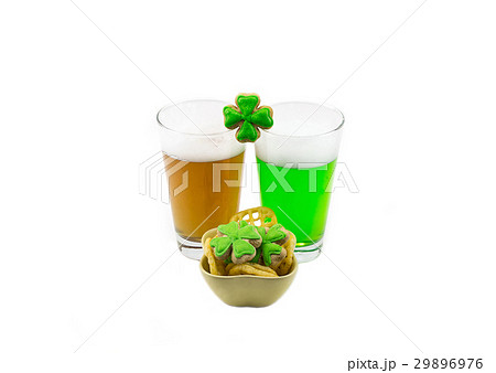 Two glasses of a foamy drink amber and green beer Two glasses of a foamy drink amber and green beer 29896976