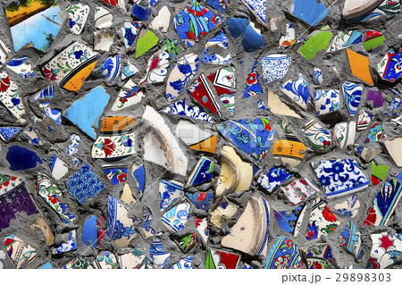 Wall with broken ceramic plates colored fragments Wall with broken ceramic plates colored fragments 29898303