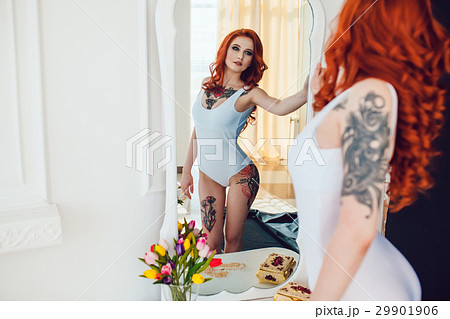 Beautiful sexy girl with red hair and tattoo in Beautiful sexy girl with red hair and tattoo in 29901906
