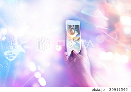 Music fans takes photo guitarist in concert Music fans takes photo guitarist in concert 29911546