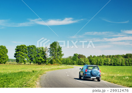 Car on asphalt road in beautiful spring day 29912476