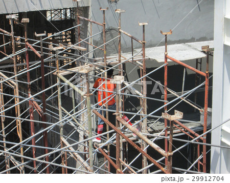 Scaffolding used at the construction site Scaffolding used at the construction site 29912704