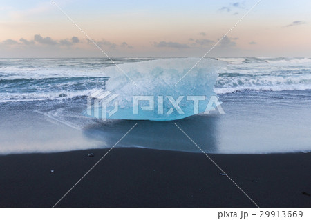 Ice breaking on black sand beach ocean skyline Ice breaking on black sand beach ocean skyline 29913669