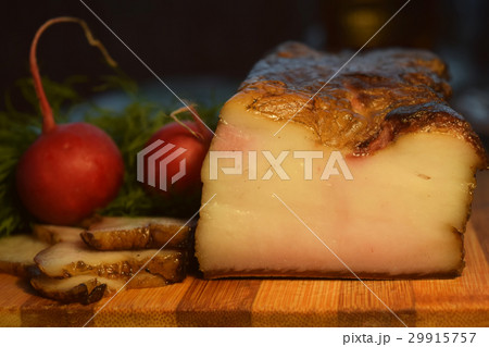 Smoked bacon on wooden table 29915757