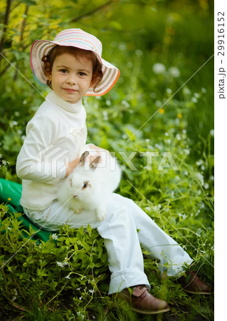 cute little girl with white rabbit 29916152