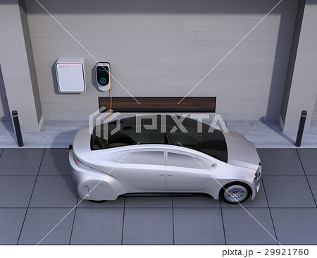 つや消しシルバーの電気自動車、壁掛け式EV充電スタンドと蓄電池のイメージ。 つや消しシルバーの電気自動車、壁掛け式EV充電スタンドと蓄電池のイメージ。 29921760