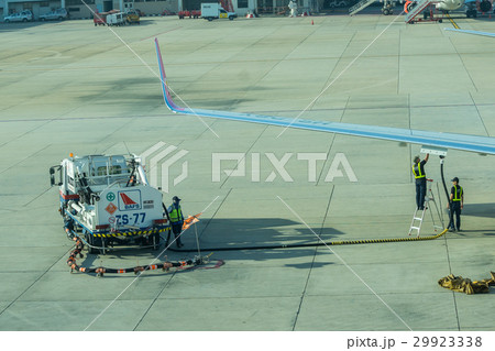 airport officer and truck Refueling to aircraft airport officer and truck Refueling to aircraft 29923338