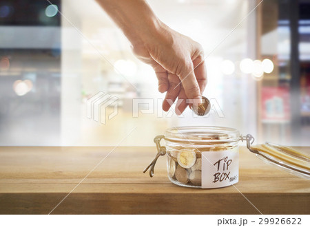 Tip box, coins in glass bowl in cafe Tip box, coins in glass bowl in cafe 29926622