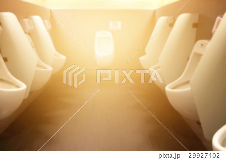 Blurred urinals in toilet for men, warm color tone 29927402