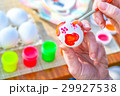 Coloring Easter eggs on the table celebration 29927538