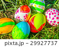 Colored Easter eggs on the grass field 29927737