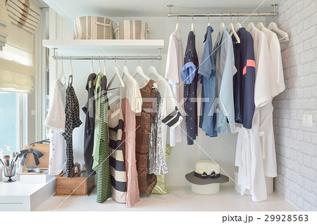 Youth cloths hanging in open wardrobe in bedroom Youth cloths hanging in open wardrobe in bedroom 29928563