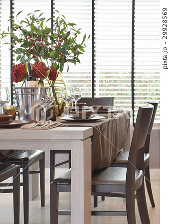 dining set on wooden table with natural lighting 29928569