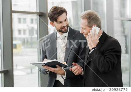 Stylish businessmen working in office Stylish businessmen working in office 29928773