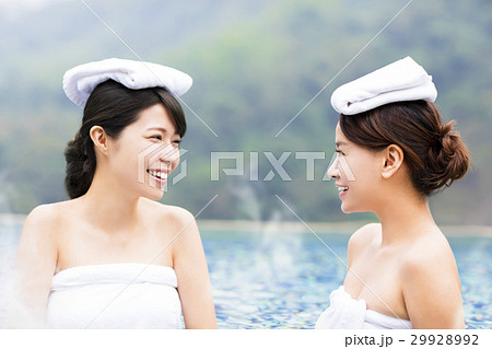 happy young woman relaxing in  hot springs 29928992