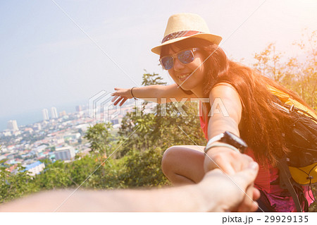Woman pulls guy by hand Woman pulls guy by hand 29929135