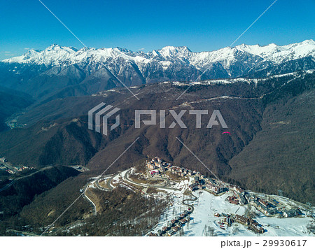 Paraglider flies over the mountains over the ski Paraglider flies over the mountains over the ski 29930617