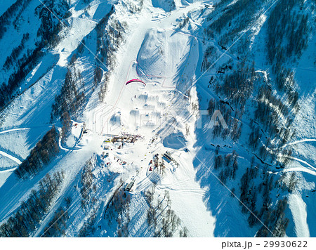Paraglider flies over the mountains over the ski Paraglider flies over the mountains over the ski 29930622