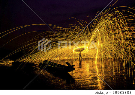 Man playing fire baton in Texture background 29935303