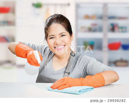 asian housewife sweeping on table asian housewife sweeping on table 29936282