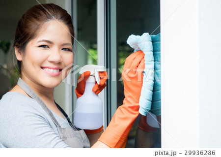 asian housewife cleaning on window glass 29936286