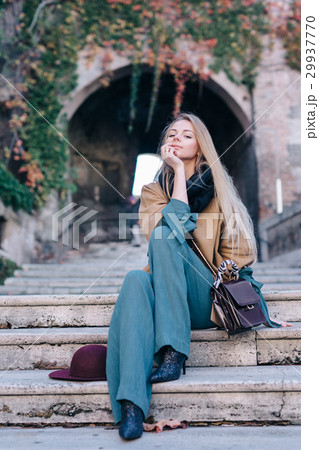 Blonde woman outdoors city walk fashion lifestyle 29937770