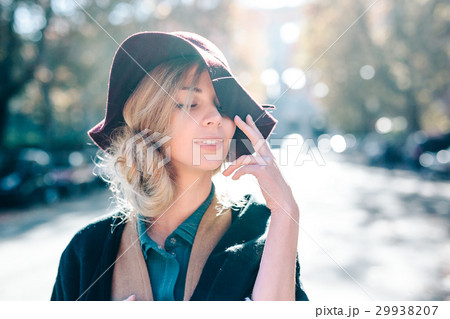 Blonde woman dreaming in hat closeaup fashion 29938207