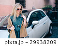 Rental car customer fyoung woman blonde hair 29938209