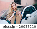 Rental car customer fyoung woman blonde hair 29938210