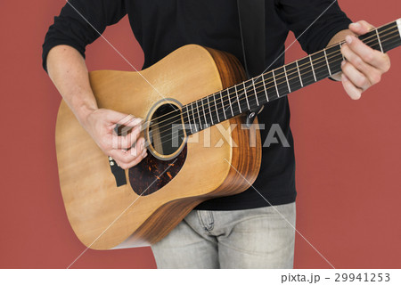 Caucasian Man Playing Guitar Closeup Caucasian Man Playing Guitar Closeup 29941253