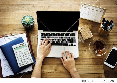 Woman Working Plan On A Wooden Table Woman Working Plan On A Wooden Table 29941320
