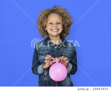 Portrait of a Little African Descent Boy with a Balloon Isolated 29945854