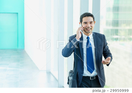 Business man walking and using mobile to chatting  29950999