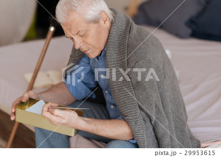 Sad depressed man looking at the photo 29953615