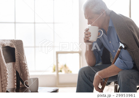 Desperate aged man looking at the empty chair Desperate aged man looking at the empty chair 29953961