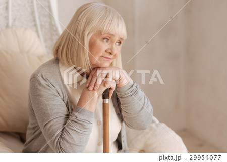 Unhappy depressed woman leaning on her walking 29954077