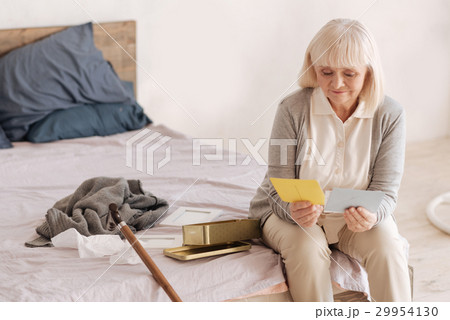 Nice elderly woman reading letters 29954130