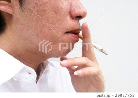 Man smoking a cigarette Man smoking a cigarette 29957755