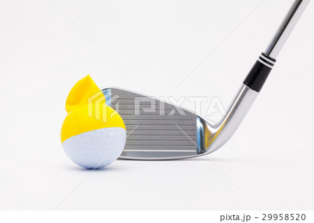 White golf ball with funny cap and golf club  29958520
