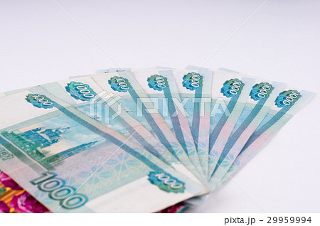 A stack of thousand-ruble banknotes, spread out A stack of thousand-ruble banknotes, spread out 29959994