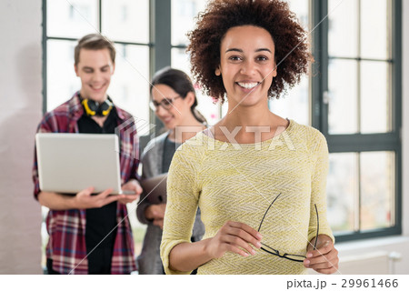 Portrait of cheerful employee looking at camera  29961466
