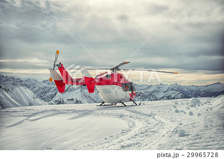 Helicopter mountain rescue service in the winter 29965728